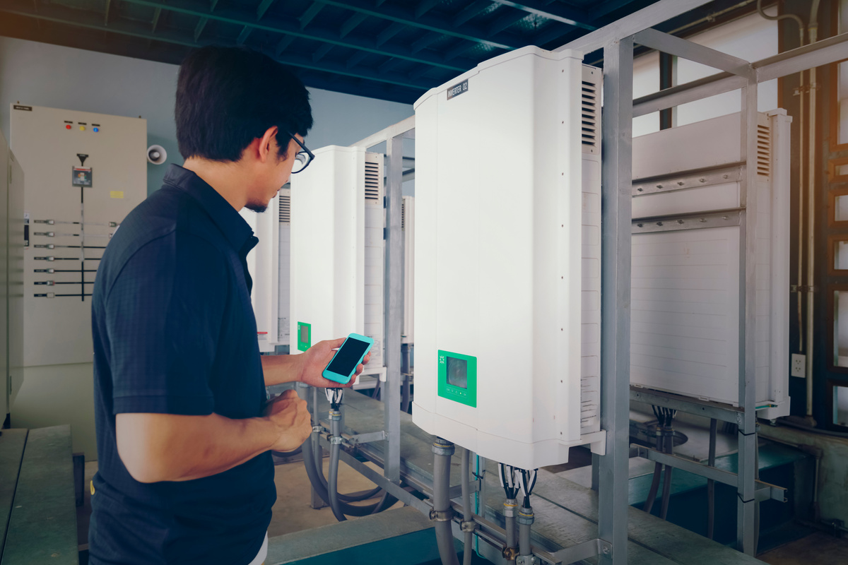 Inverter solar panel with technicians checking